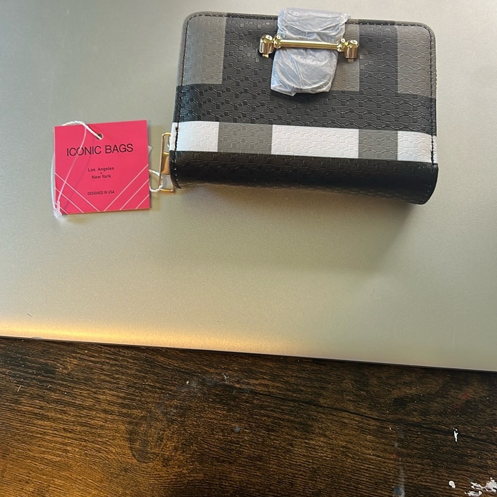 Compact Black and Gray Wallet with Metallic Accents